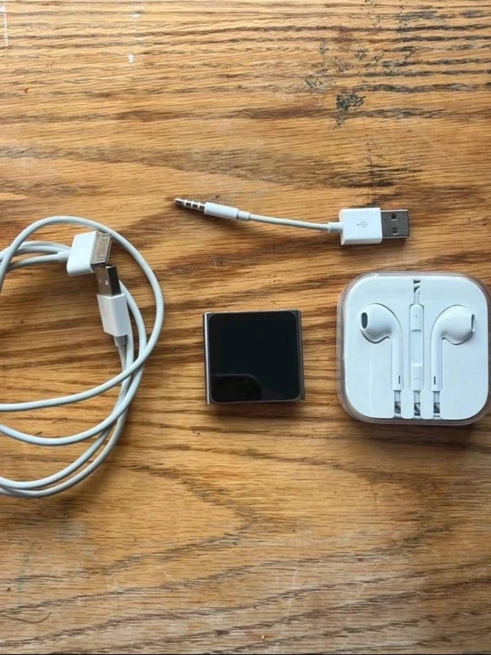 Apple Silver and White iPod Nano with White EarPods and USB Cable